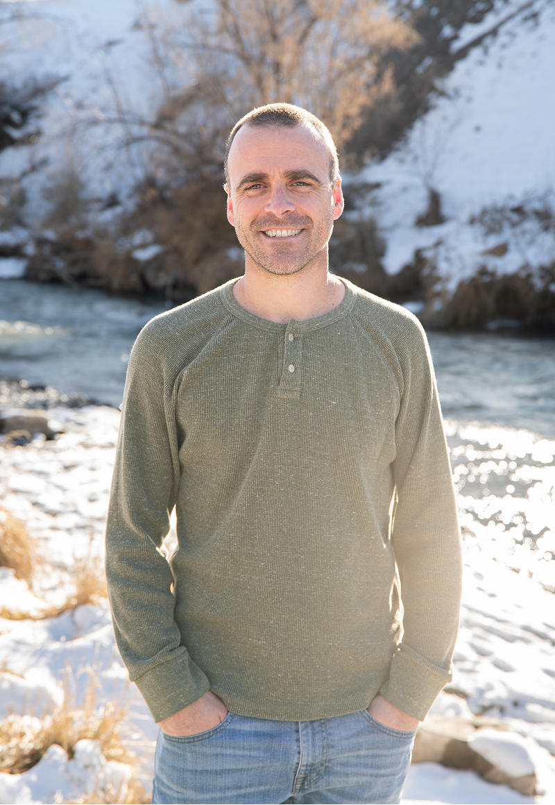 Adam Woodden, candidate for Montrose City Council, smiling in professional attire